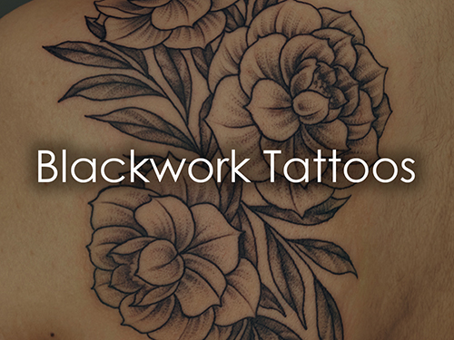 Close-up of a blackwork floral tattoo on skin with the words 'Blackwork Tattoos' overlaid.