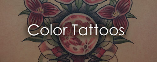 Tattoo design featuring pink-red flowers around a circular central mandala on skin with the words 'Color Tattoos' overlaid