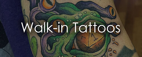 Colorful forearm tattoo of a green sea monster with purple tentacles and orange eyes; overlaid with the words “Walk-in Tattoos.”